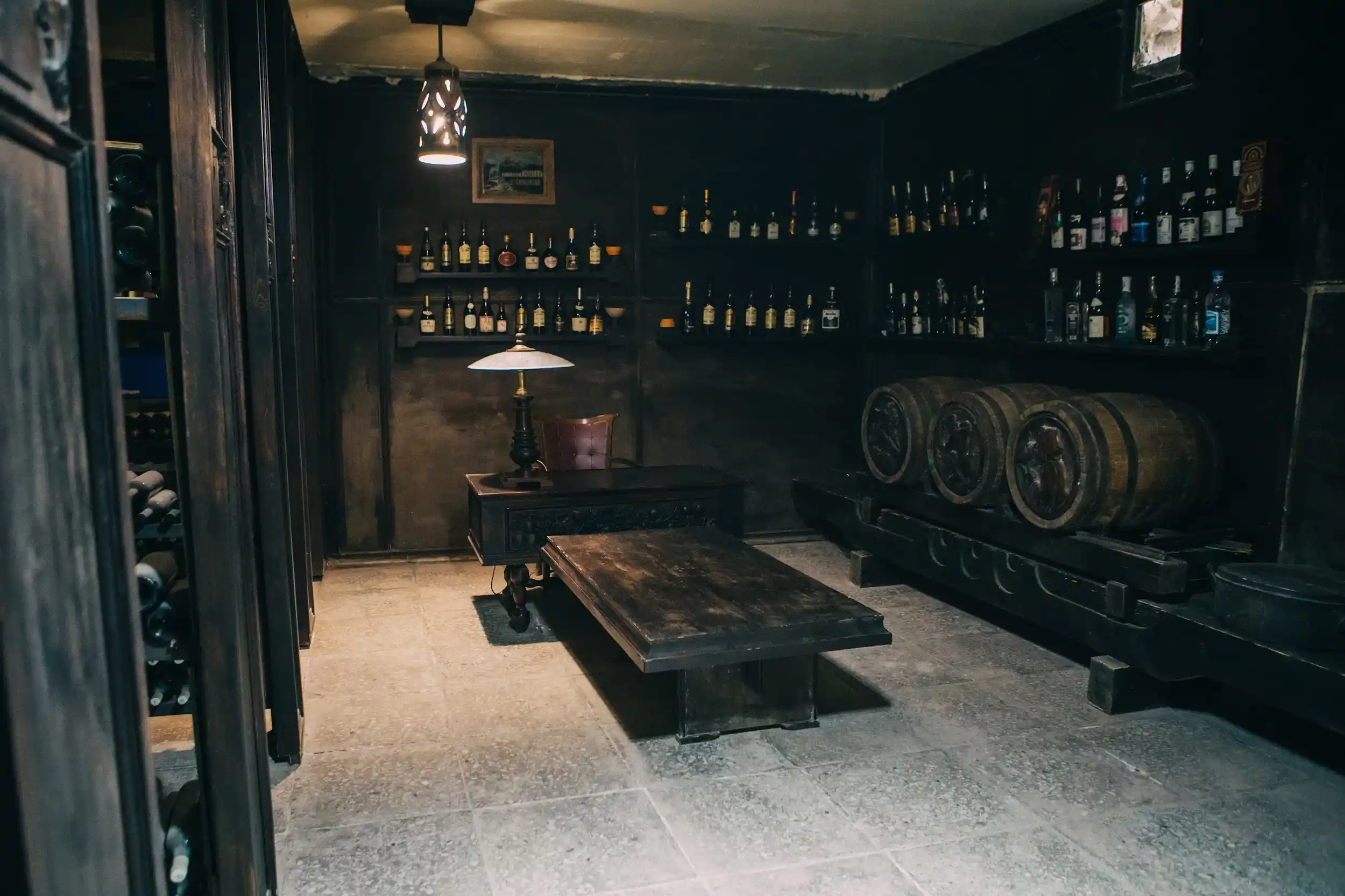 The old cellar with casks and a tasting table