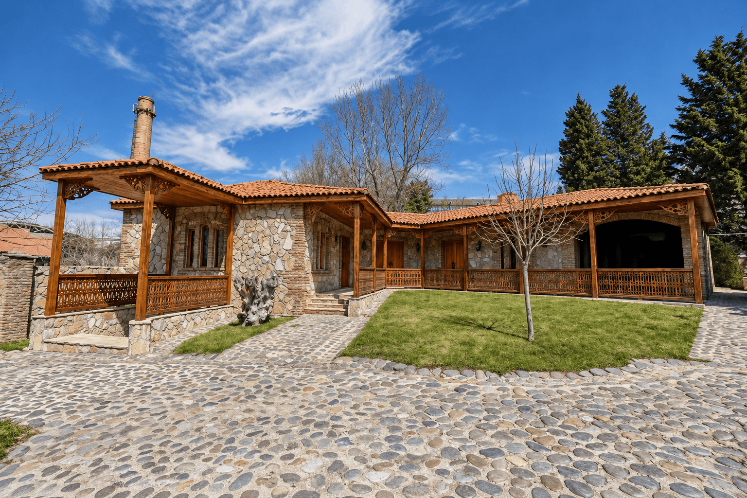 The estate courtyard and its carved wooden galleries